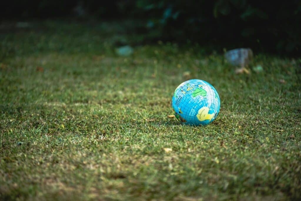 Desk globe on green grass