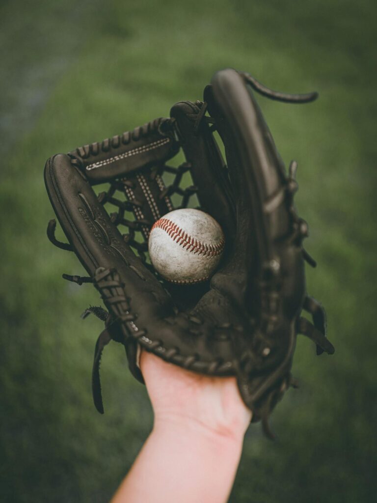 Person holding baseball ball