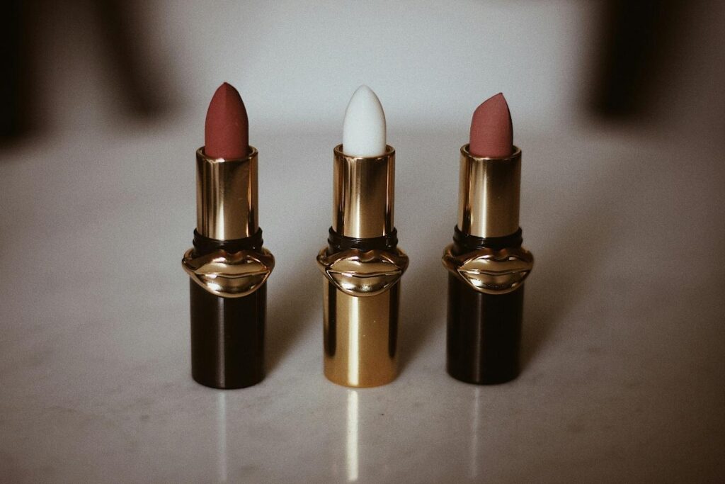 three lipsticks gold packaging